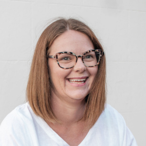 Felicity Haylock smiling wearing a white t-shirt